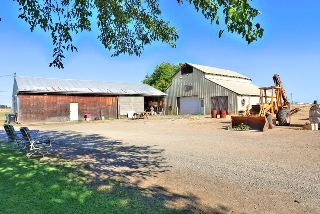 a front view of a house with a yard and a garage