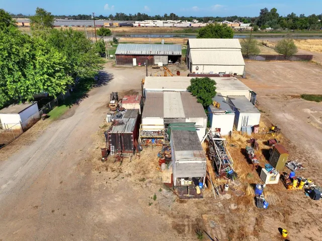 an aerial view of a house with a lake view