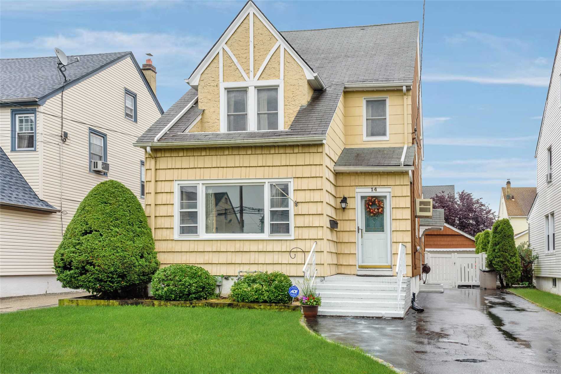 14 Kenmore Road Valley Stream, NY 11581 - Photo 1 of 1 a front view of a house with a yard