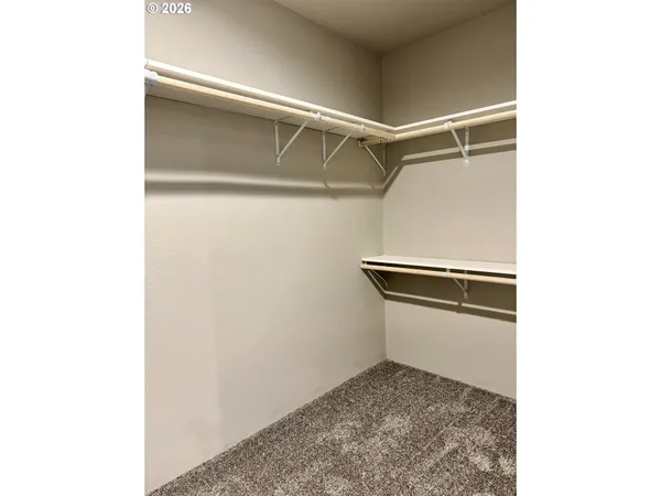 an empty room with closet area