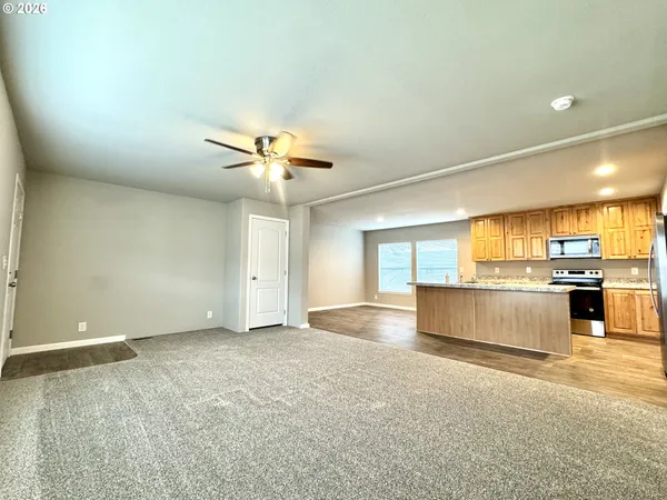 a view of a kitchen with a sink and a stove top oven