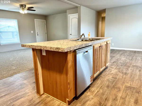 a kitchen with a stove a sink and a refrigerator