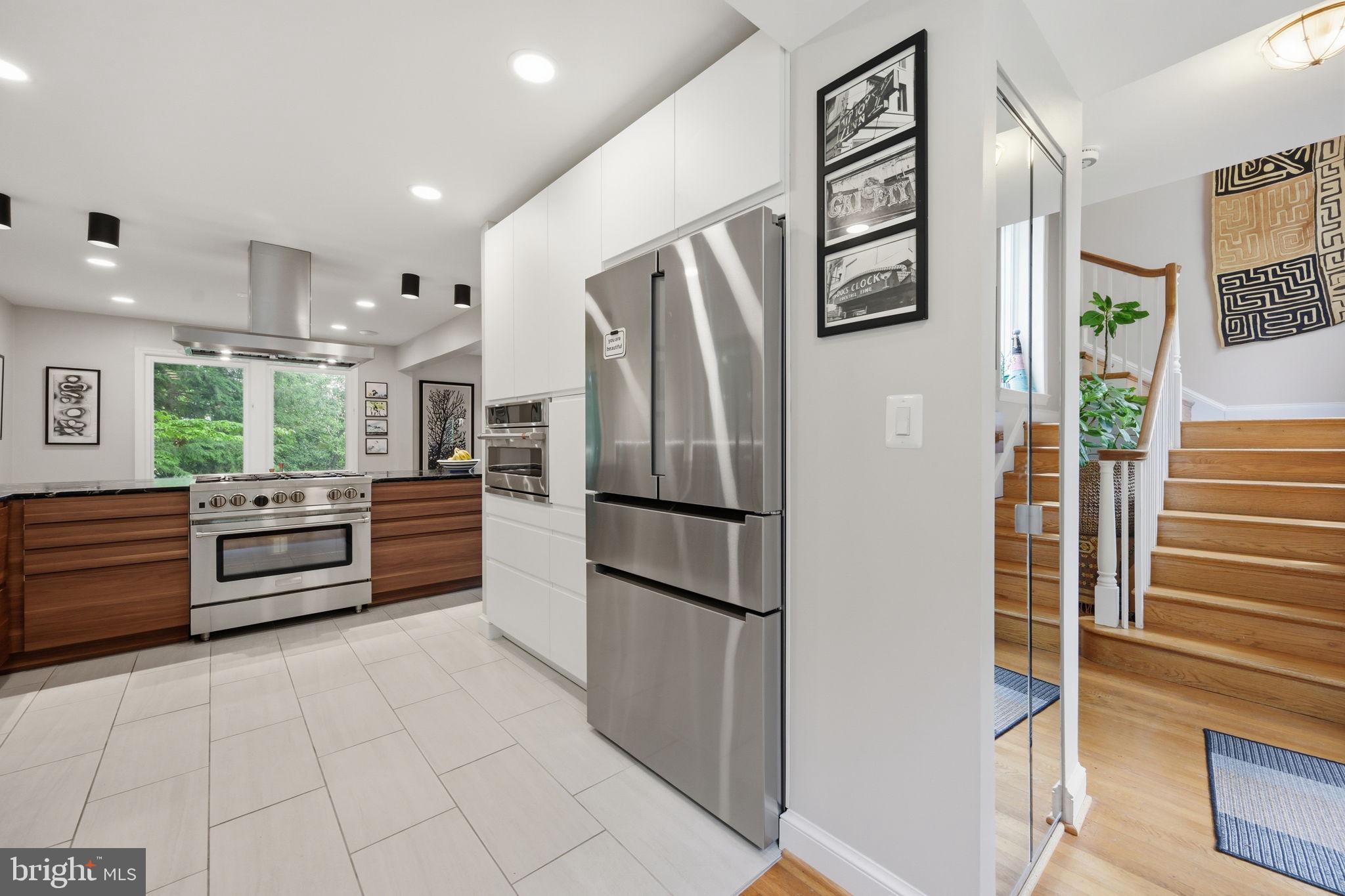 2829 29th Place Northwest Washington, DC 20008 - Photo 6 of 41 a kitchen with stainless steel appliances a refrigerator and a stove top oven
