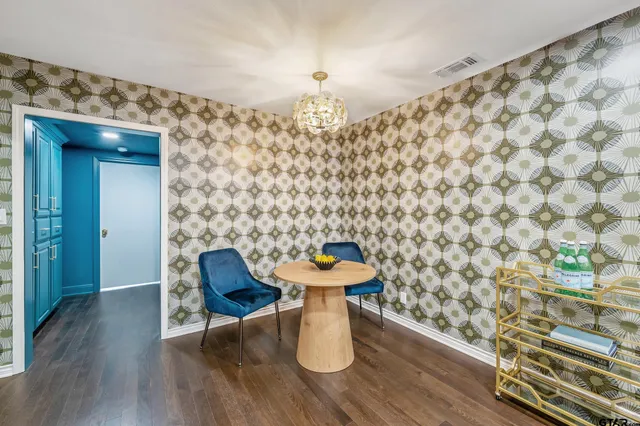 a dining room with furniture and wooden floor