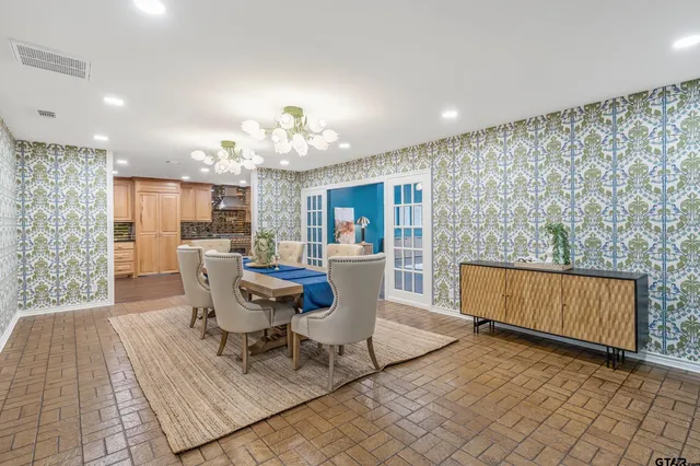 a view of a dining room with furniture and window
