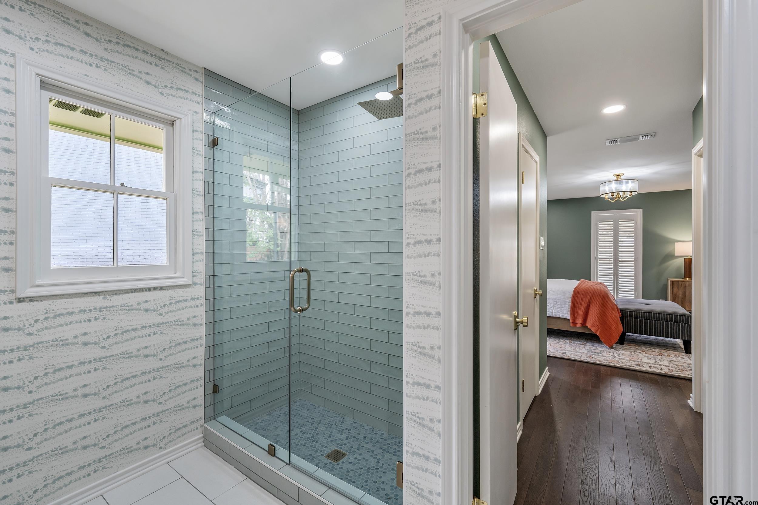 606 Tremont Place Tyler, TX 75701 - Photo 33 of 48 a en suite bathroom with a shower