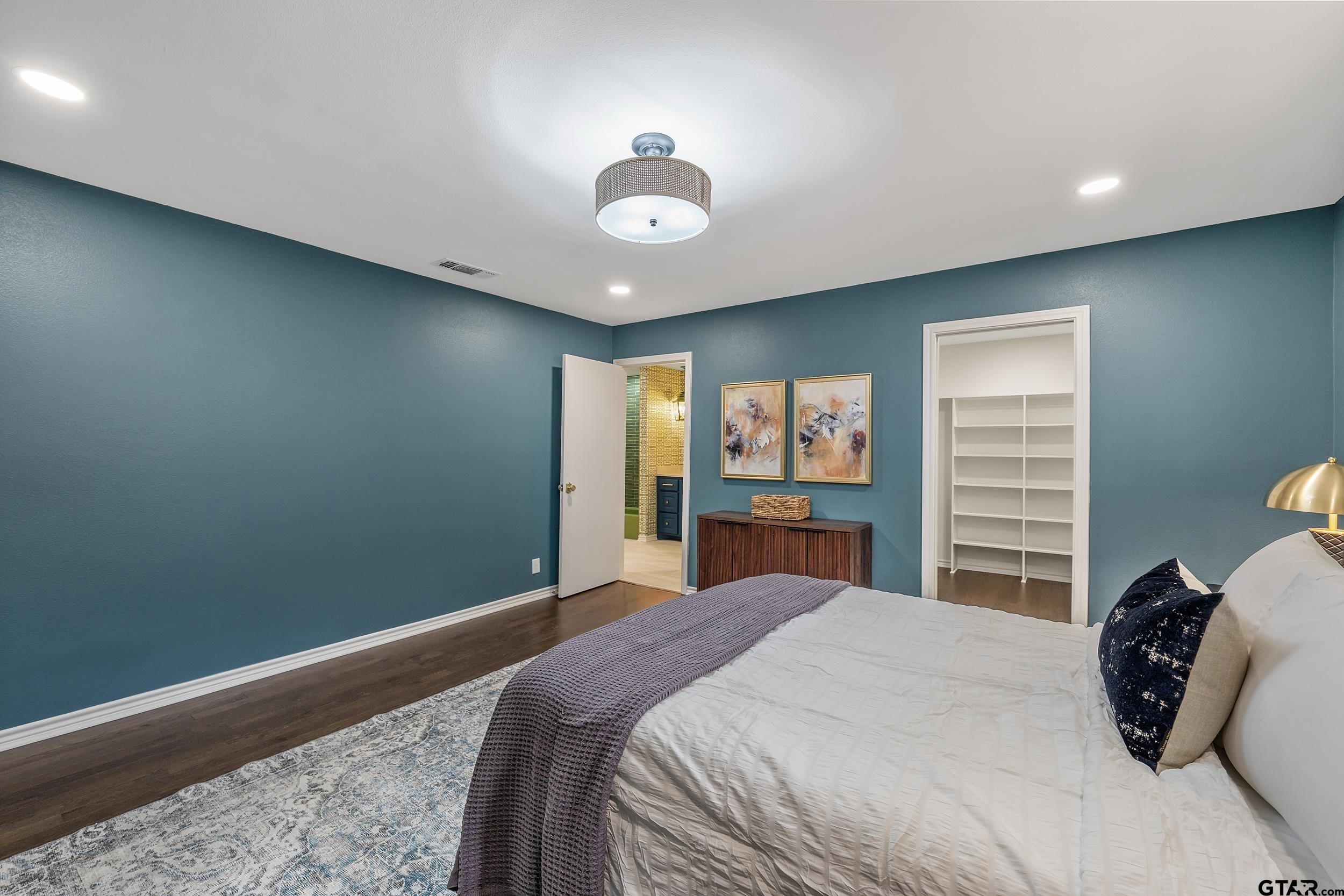 606 Tremont Place Tyler, TX 75701 - Photo 35 of 48 a bedroom with a large bed and a window