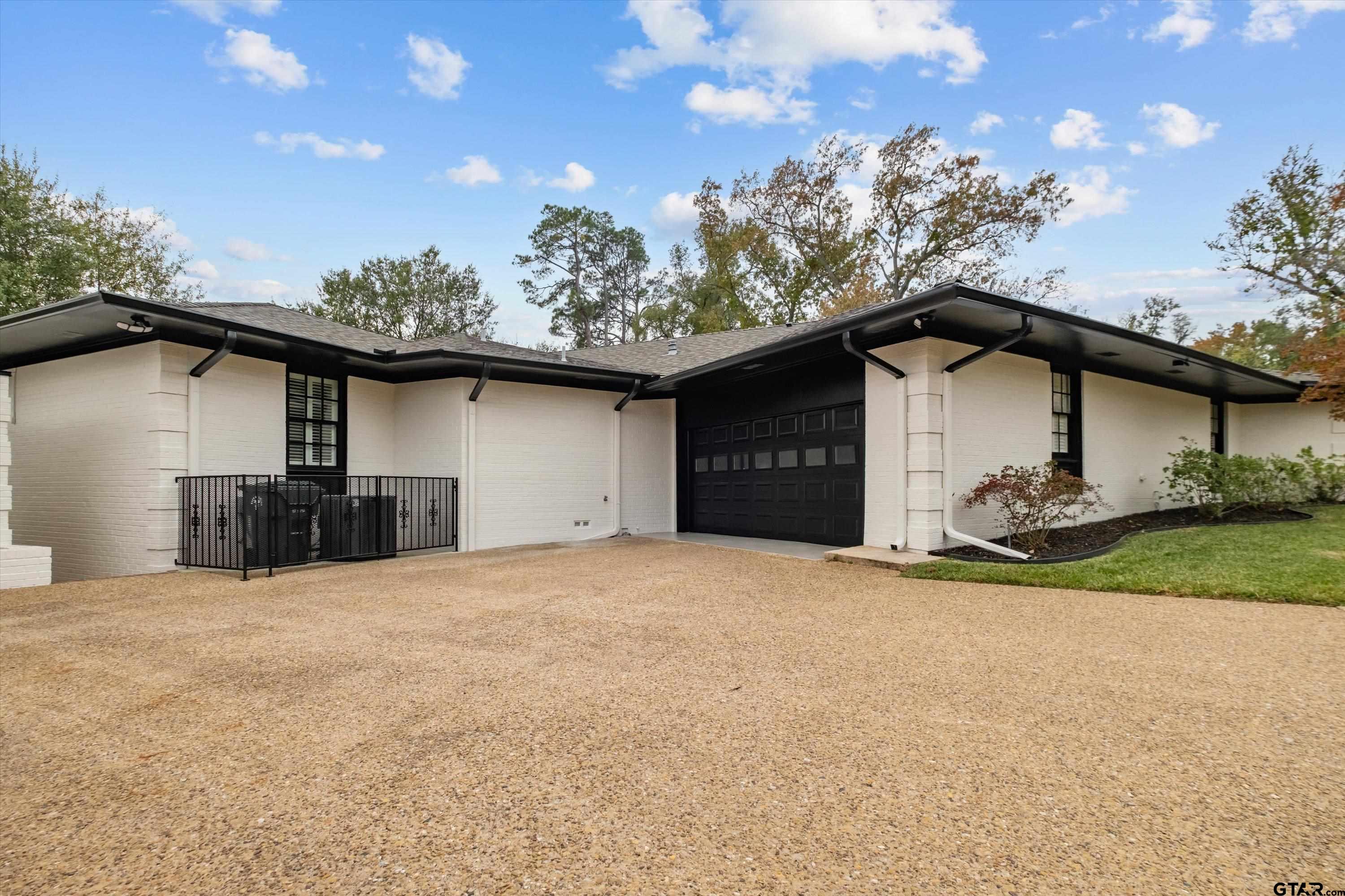 606 Tremont Place Tyler, TX 75701 - Photo 45 of 48 a view of a house with a patio
