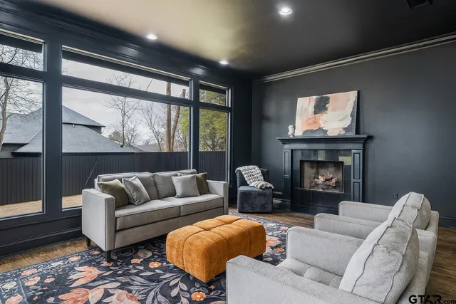 a living room with furniture and a fireplace