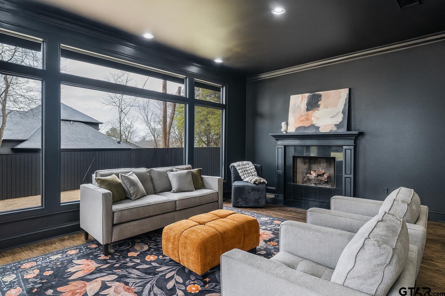 606 Tremont Place Tyler, TX 75701 - Photo 8 of 48 a living room with furniture and a fireplace