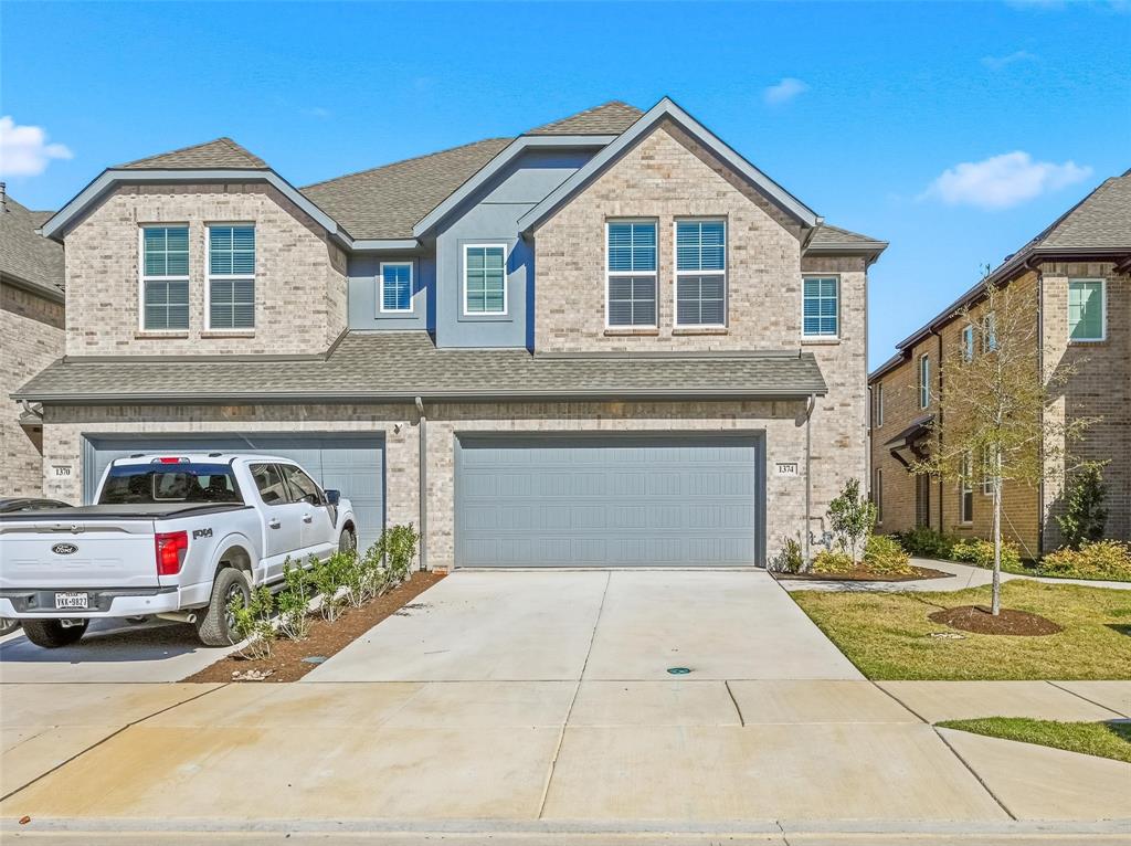 a view of a car park in front of house