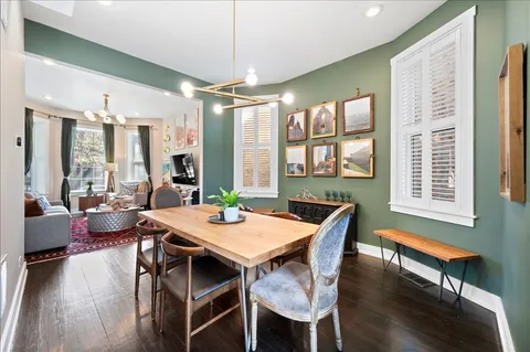 a view of a dining room with furniture window and wooden floor
