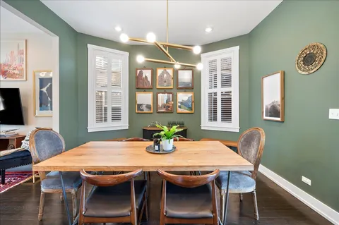 a dining room with furniture and window