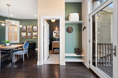 a view of a porch with furniture window and wooden floor