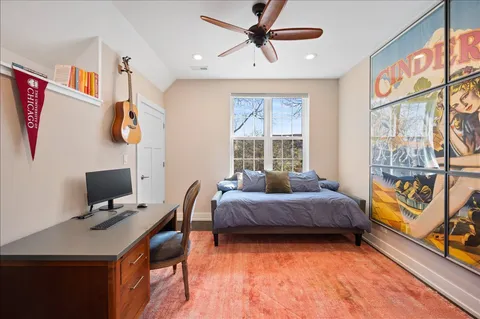 a bedroom with furniture and windows