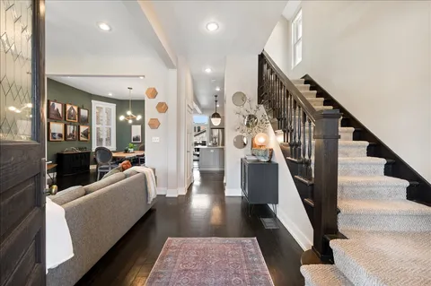 a living room with furniture and a rug