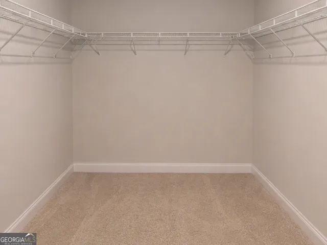 a view of a room with shelf on the wall