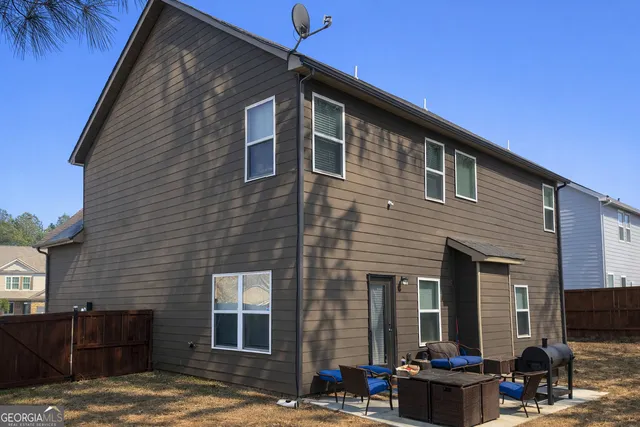 a backyard of a house with seating space