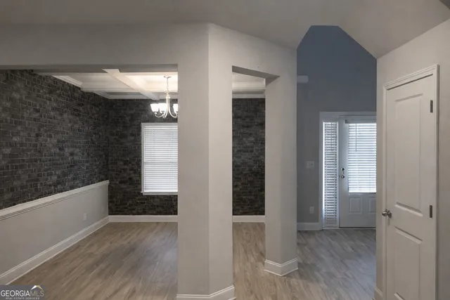 a view of gallery with wooden floor