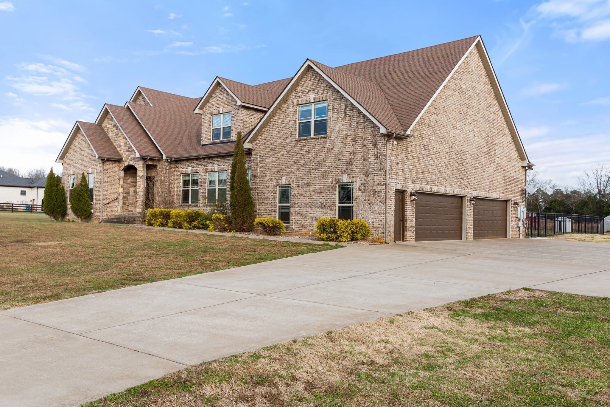 7607 Midland Road Christiana, TN 37037 - Photo 18 of 48 a front view of a house with a yard and garage