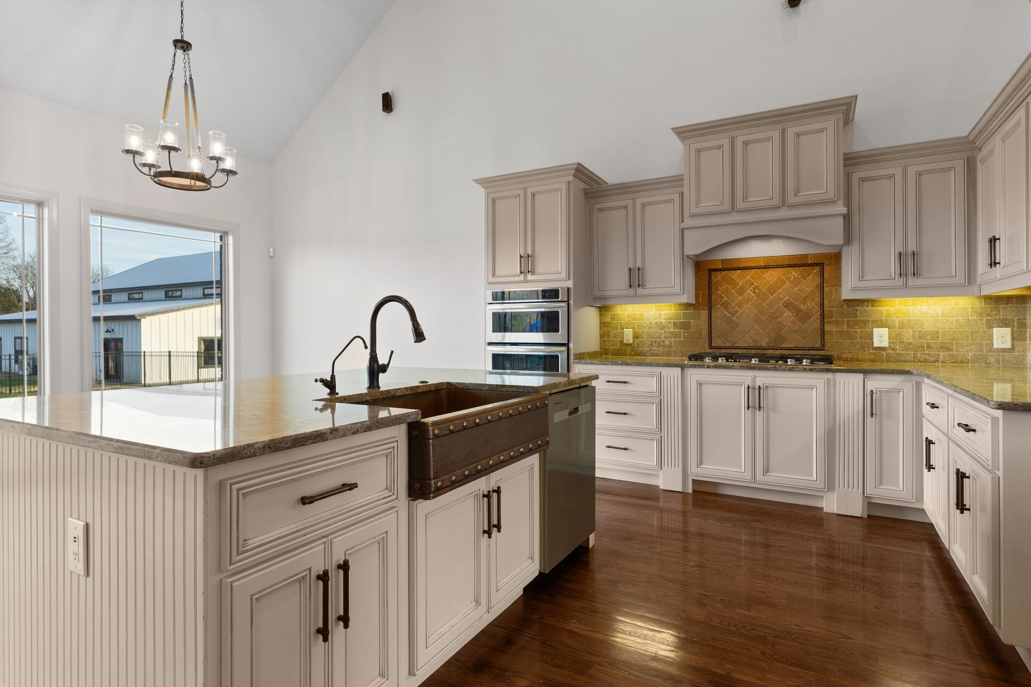 7607 Midland Road Christiana, TN 37037 - Photo 23 of 48 a kitchen with granite countertop white cabinets and white appliances