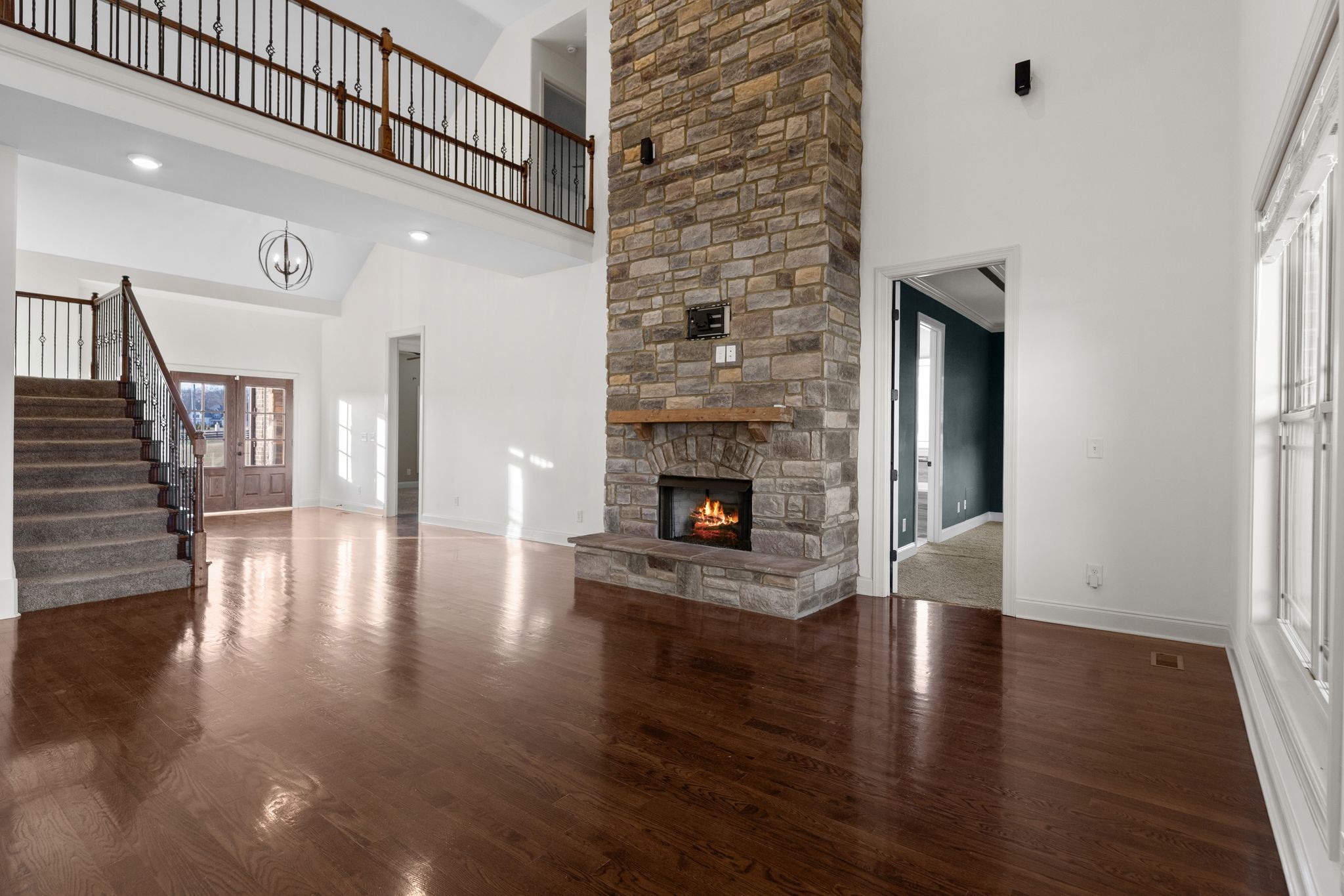 7607 Midland Road Christiana, TN 37037 - Photo 26 of 48 a view of a livingroom with wooden floor and a fireplace
