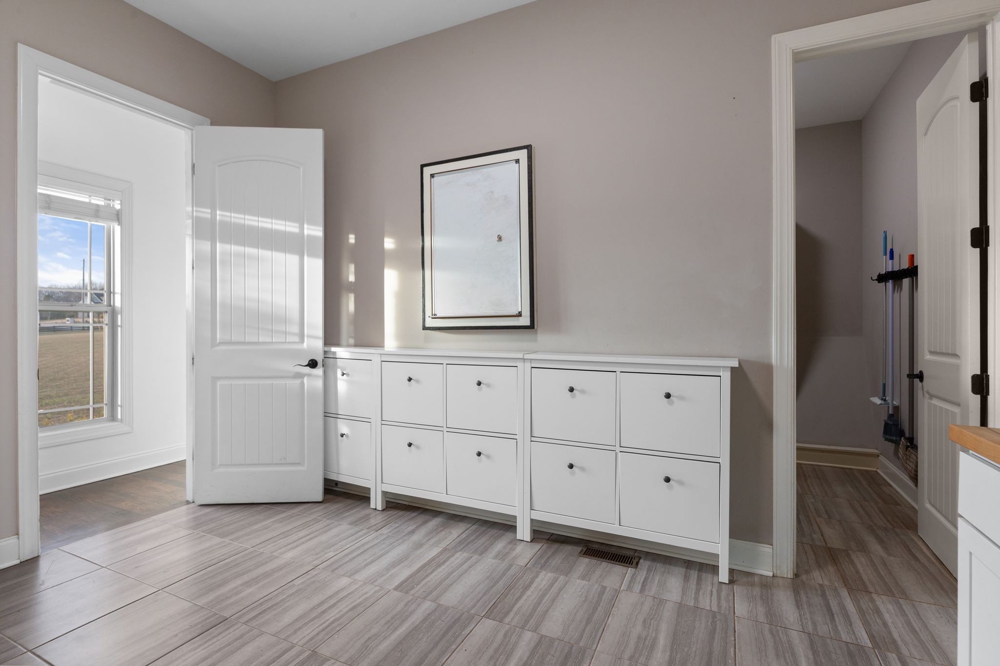 7607 Midland Road Christiana, TN 37037 - Photo 29 of 48 an empty room with mirror and a wooden door