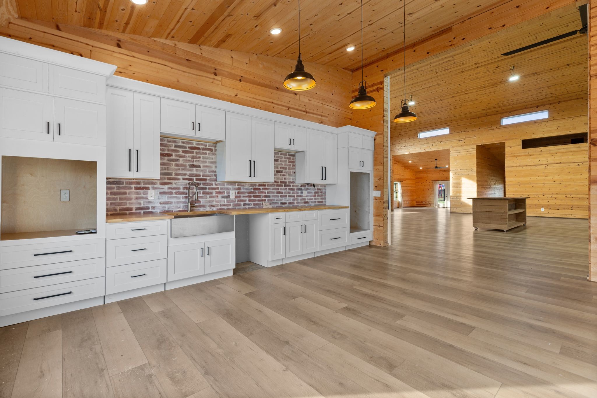 7607 Midland Road Christiana, TN 37037 - Photo 37 of 48 a large kitchen with stainless steel appliances kitchen island granite countertop a stove a sink and white cabinets