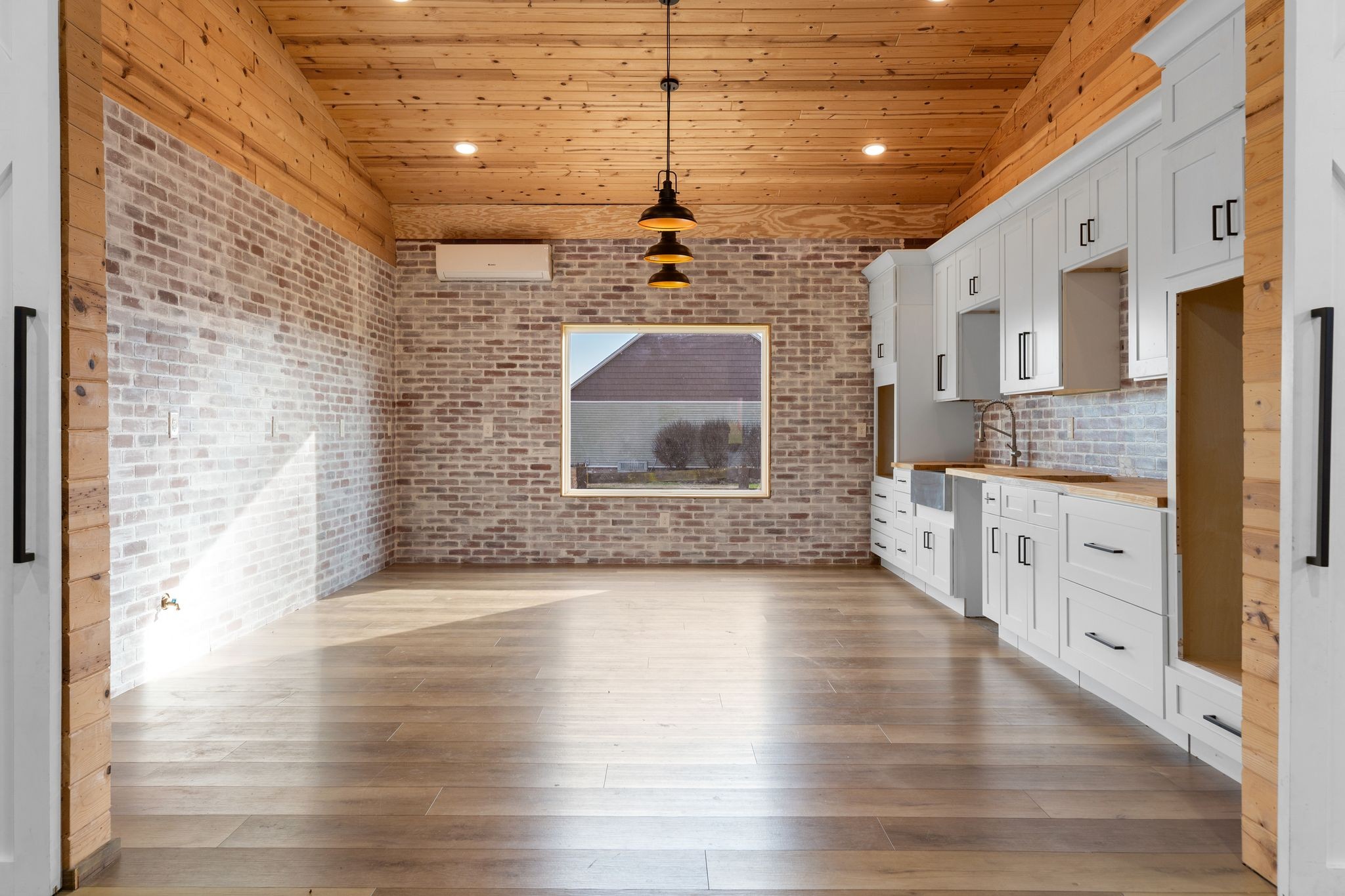 7607 Midland Road Christiana, TN 37037 - Photo 38 of 48 a view of a hallway with wooden floor and a kitchen