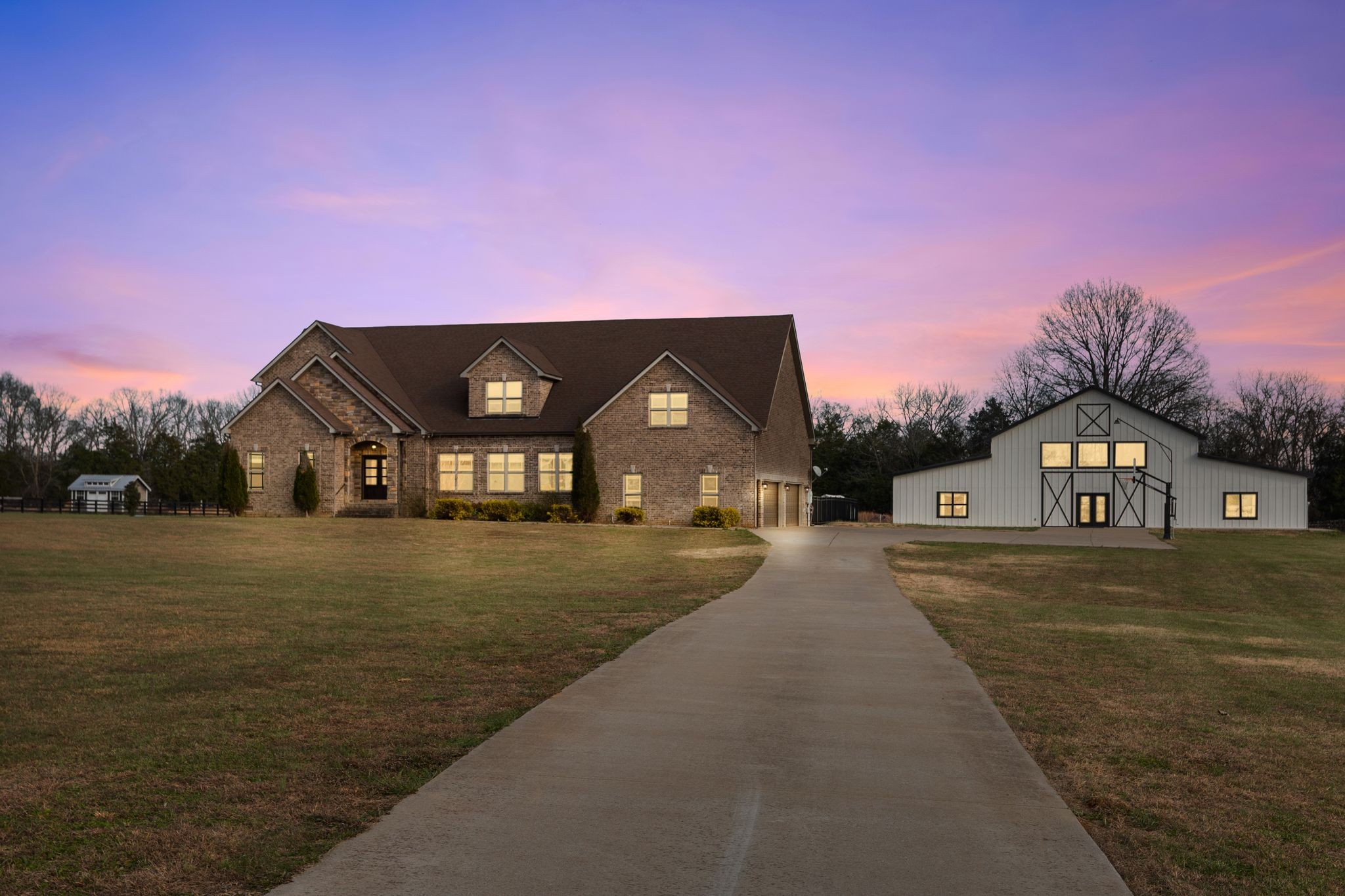 7607 Midland Road Christiana, TN 37037 - Photo 6 of 48 a view of a big house with a big yard and a large trees