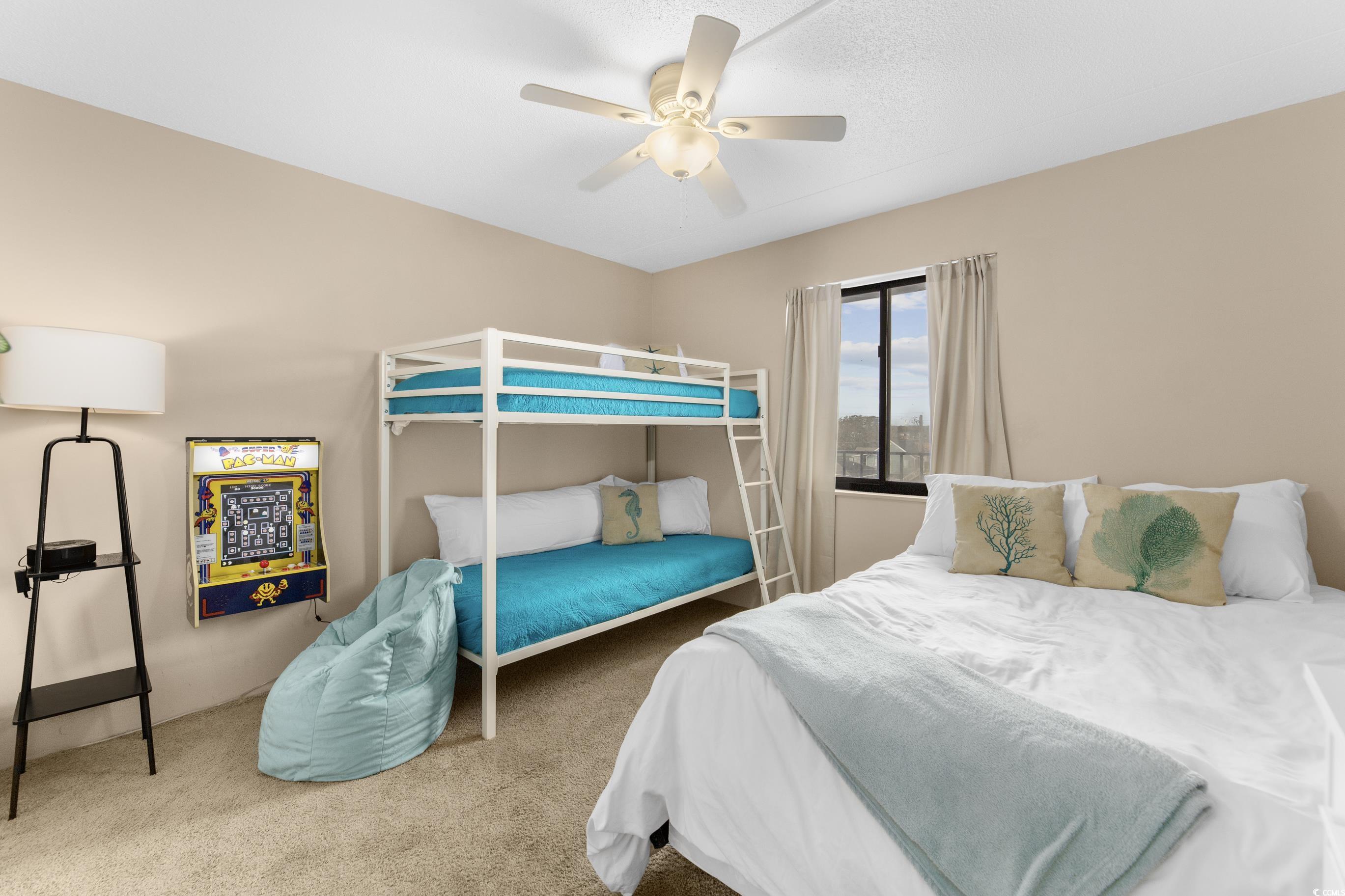 1108 North Waccamaw Drive, Unit 304 Murrells Inlet, SC 29576 - Photo 18 of 34 Carpeted bedroom featuring ceiling fan