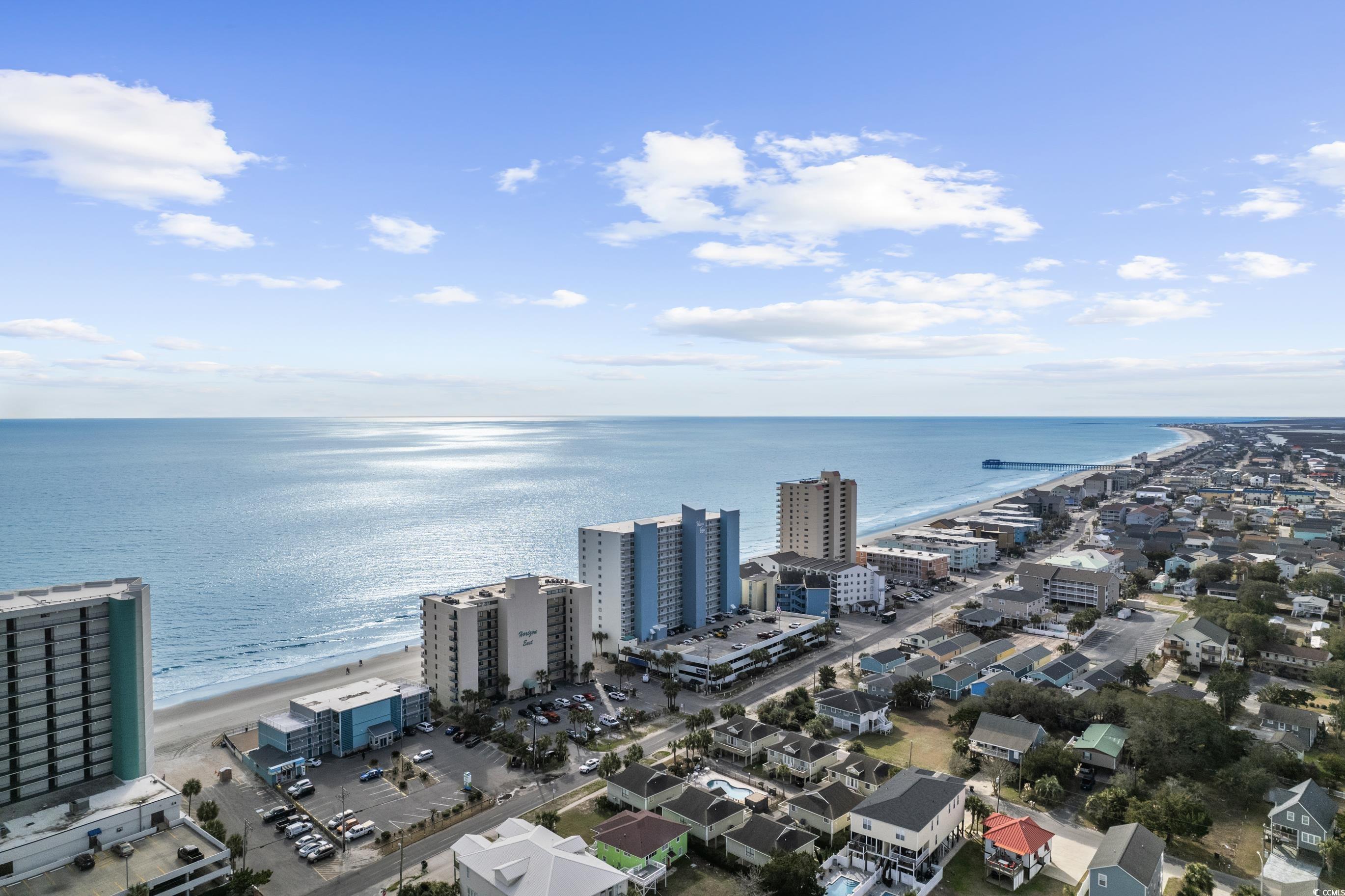 1108 North Waccamaw Drive, Unit 304 Murrells Inlet, SC 29576 - Photo 24 of 34 Drone / aerial view of waterfront with a beach