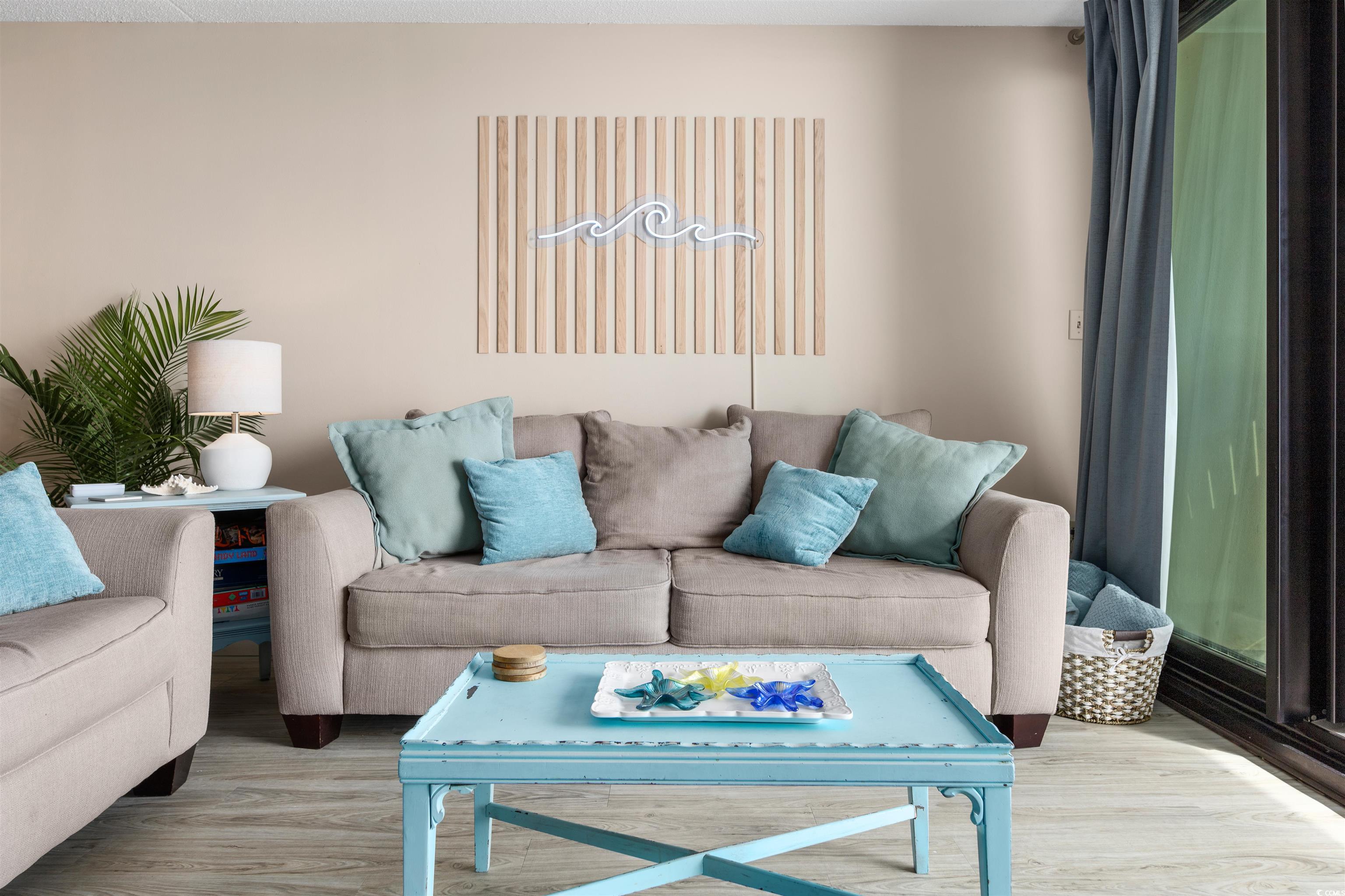 1108 North Waccamaw Drive, Unit 304 Murrells Inlet, SC 29576 - Photo 4 of 34 Living room with wood finished floors
