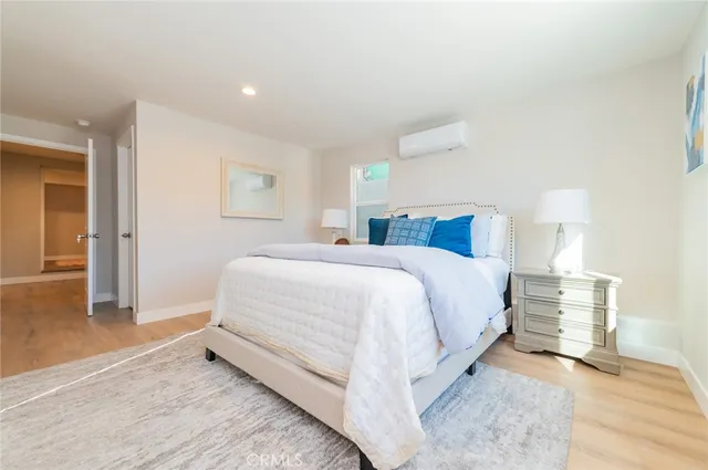 a bed room with a bed and a night stand