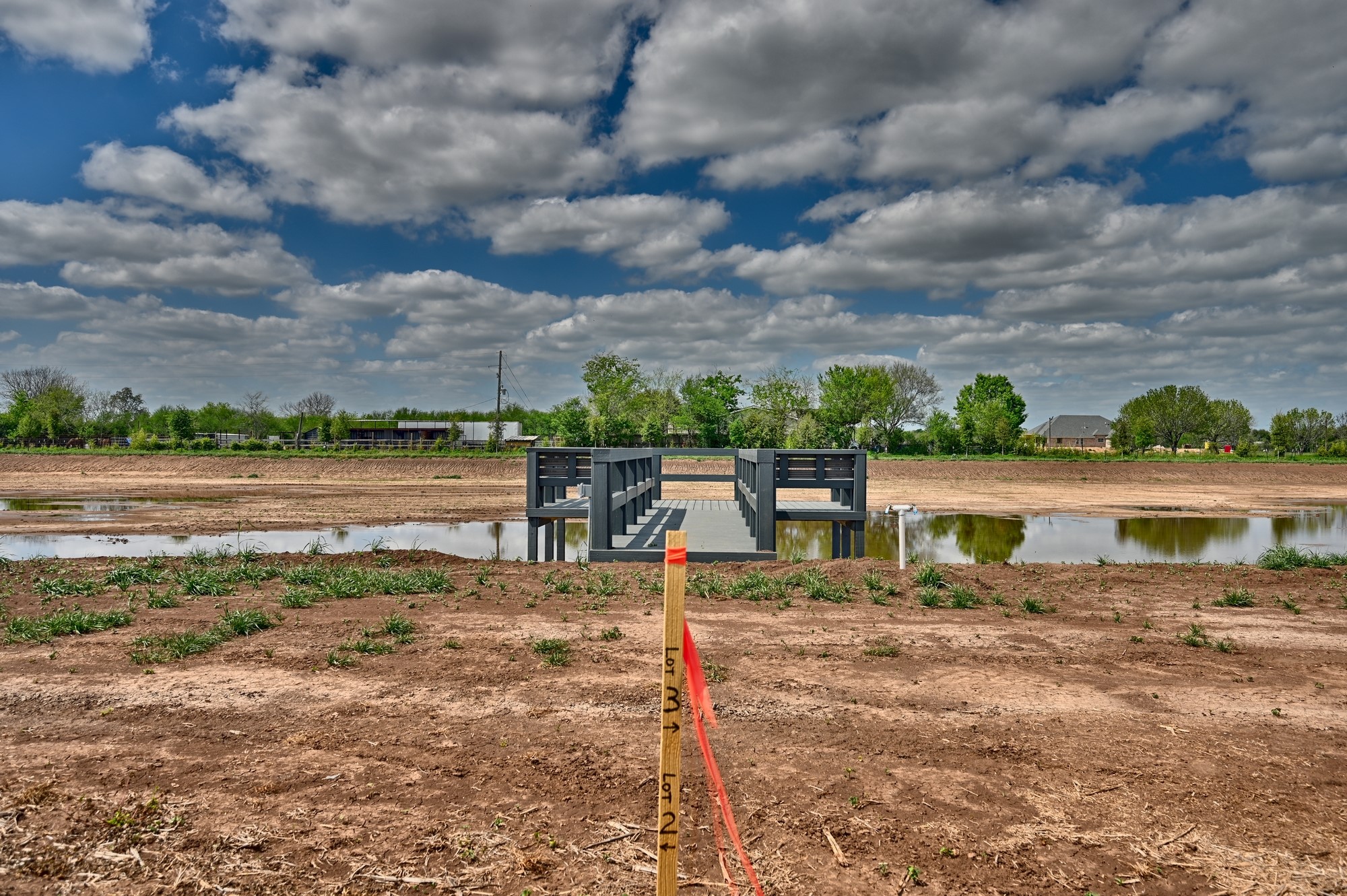 0 Bartlett Road Sealy, TX 77474 - Photo 6 of 14 a view of a lake with a house