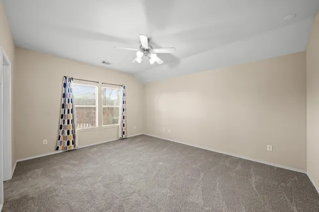 a view of an empty room with a bathroom