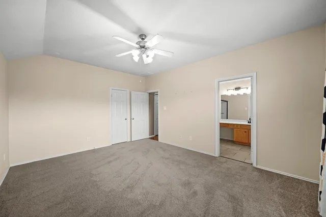 a bathroom with a double vanity sink mirror and shower