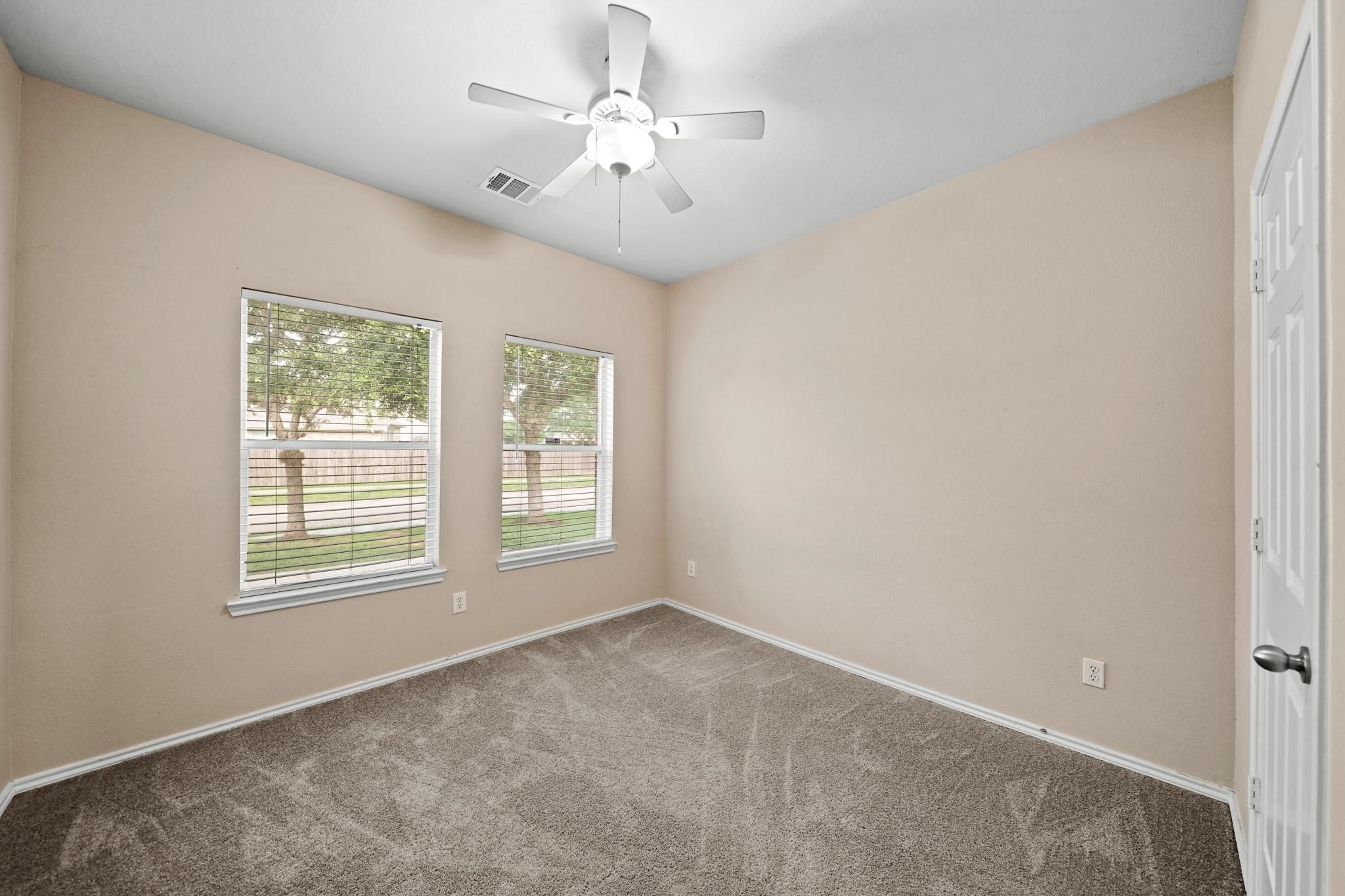 2813 Waterside Trail Pearland, TX 77584 - Photo 17 of 25 a view of an empty room with a window