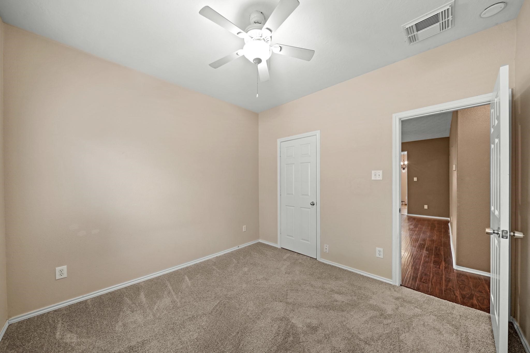 2813 Waterside Trail Pearland, TX 77584 - Photo 18 of 25 wooden floor in an empty room