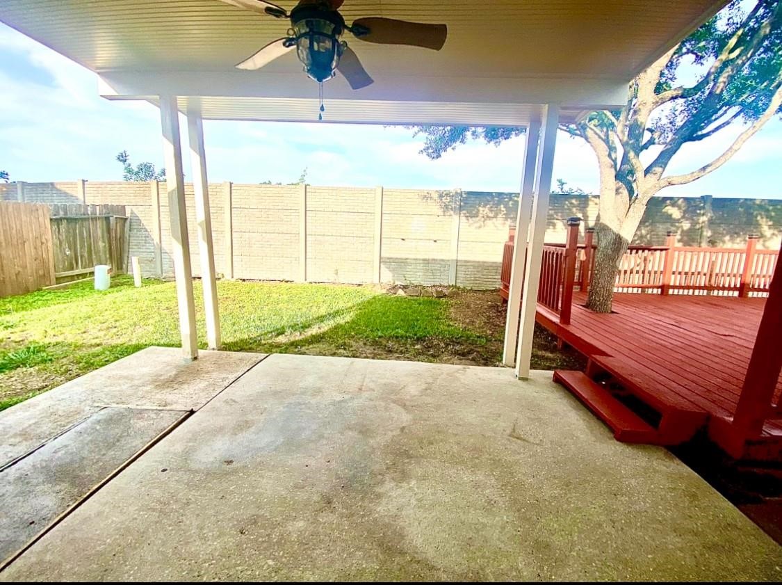 2813 Waterside Trail Pearland, TX 77584 - Photo 23 of 25 a backyard of a house with a garden and outdoor seating