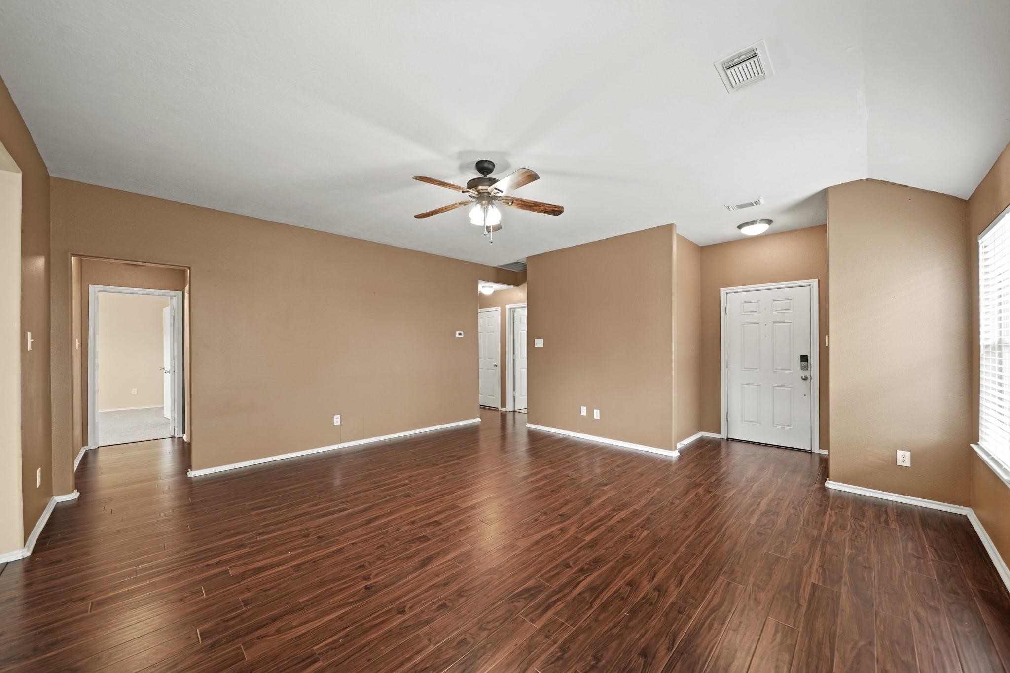 2813 Waterside Trail Pearland, TX 77584 - Photo 8 of 25 a view of an empty room with wooden floor