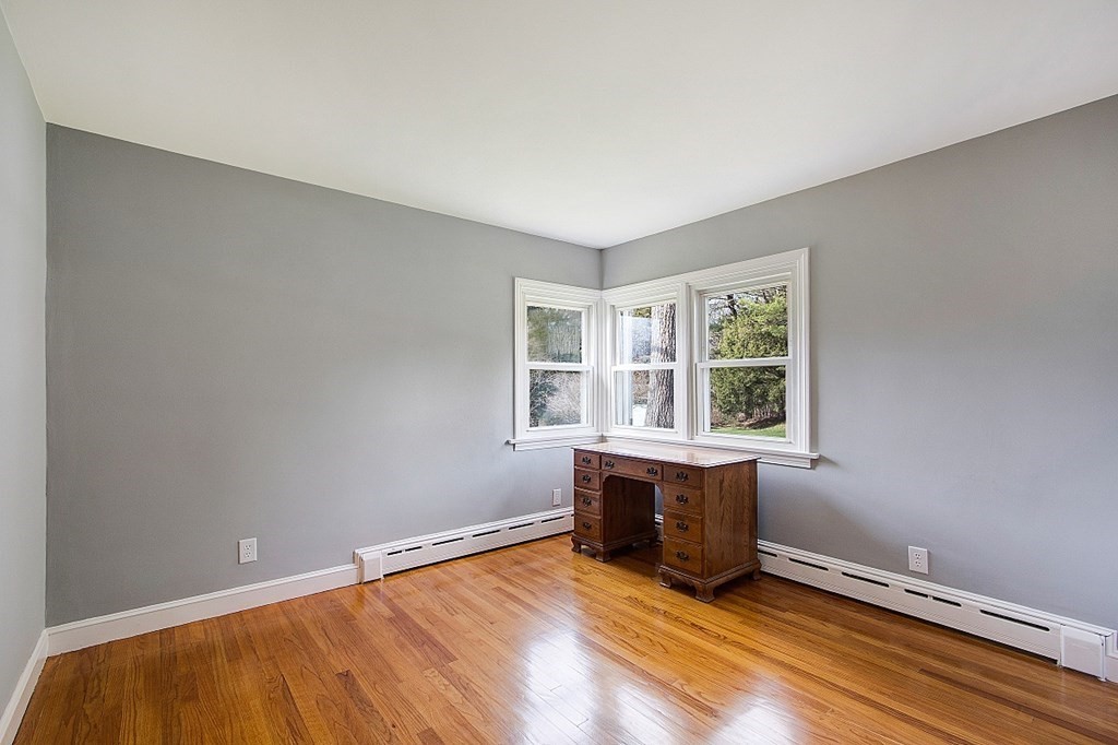 172 Minott Road Gardner, MA 01440 - Photo 18 of 36 an empty room with wooden floor and windows