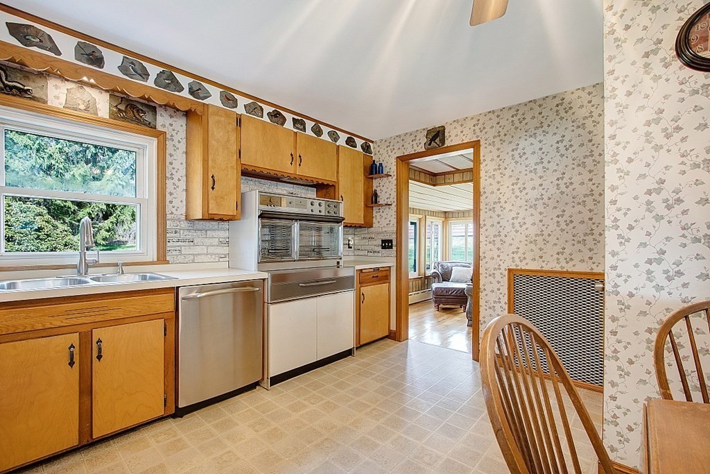 172 Minott Road Gardner, MA 01440 - Photo 10 of 36 a kitchen with stainless steel appliances granite countertop a stove a sink and a refrigerator