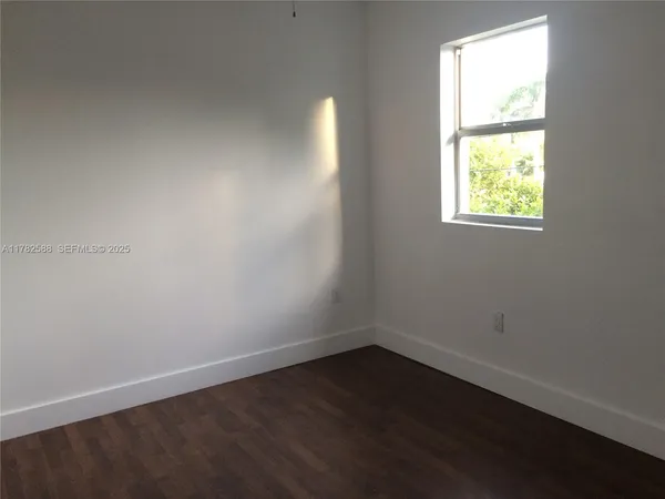 a bathroom with a sink mirror vanity and toilet