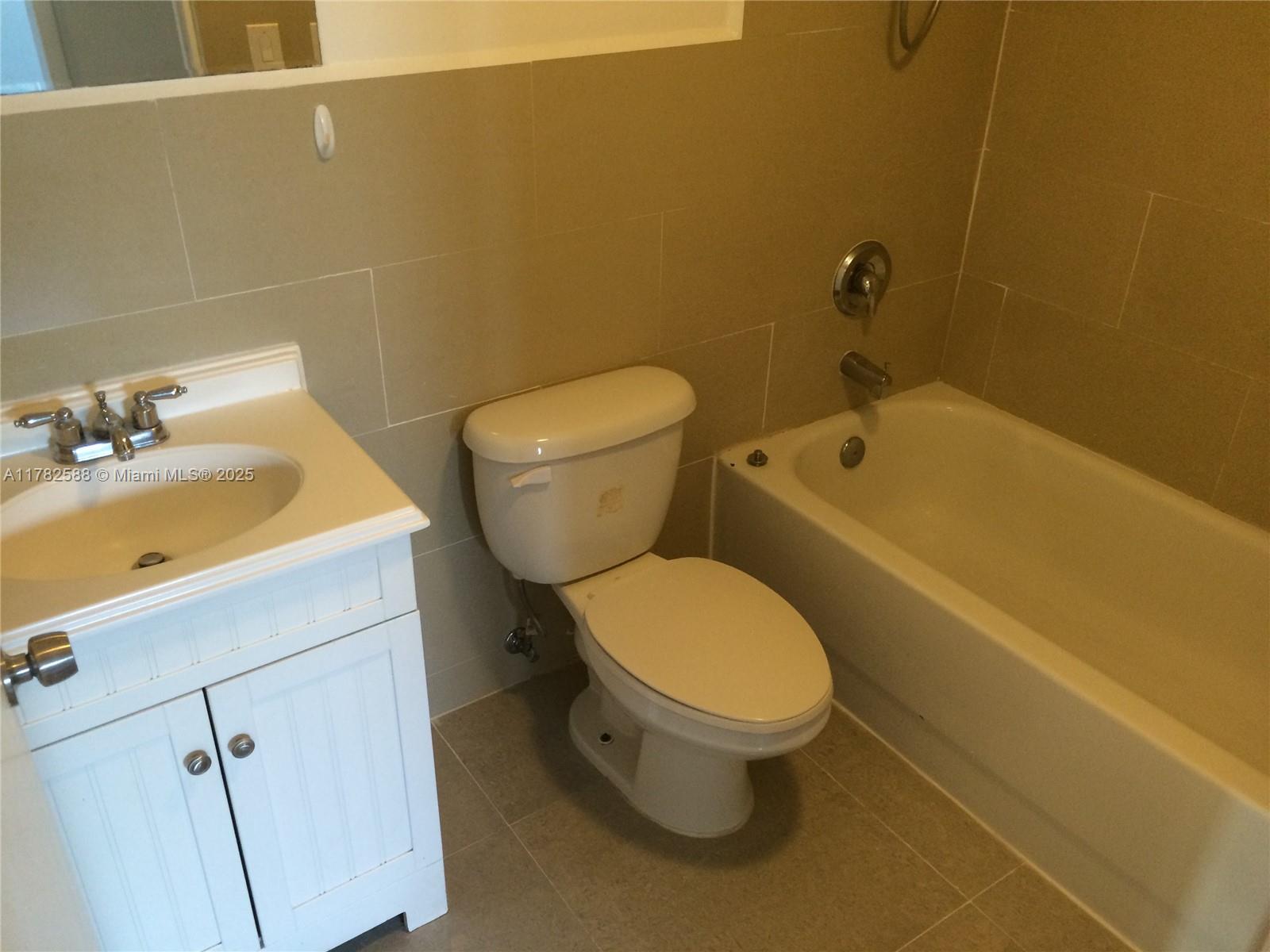 7025 Rue Granville, Unit 3 Miami Beach, FL 33141 - Photo 14 of 21 a bathroom with a sink and a toilet
