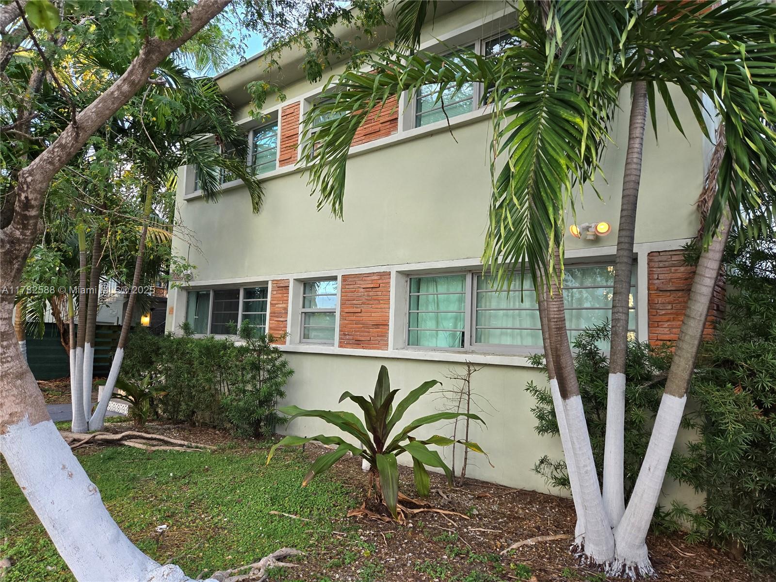 7025 Rue Granville, Unit 3 Miami Beach, FL 33141 - Photo 2 of 21 a view of front of house with a yard