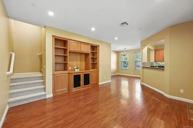 a view of kitchen with furniture and wooden floor