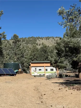 a view of a backyard of the house