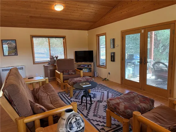 a view of fire pit with large trees