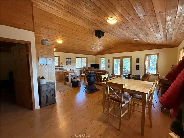 a living room with furniture a wooden floor and a window